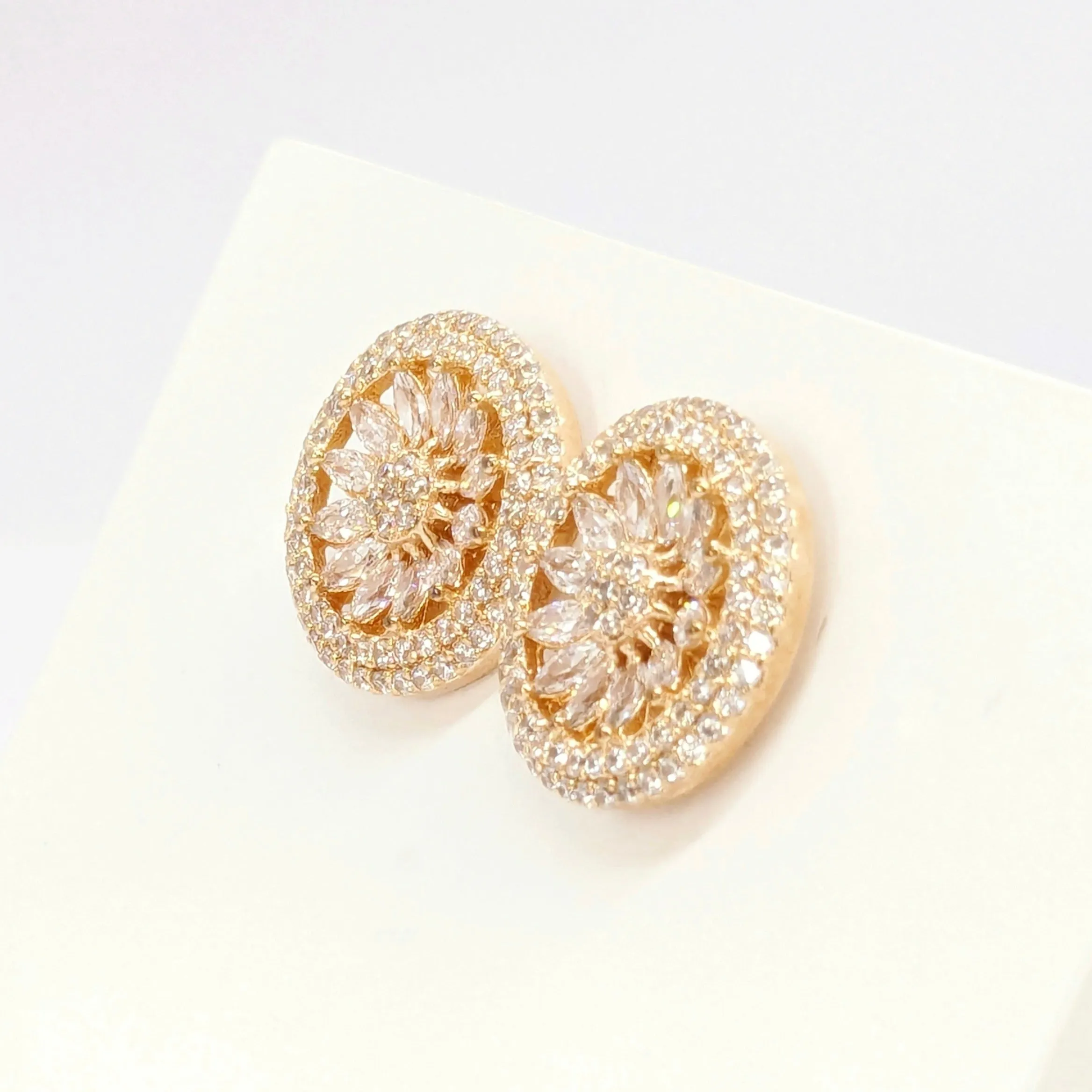 American Diamond Studded Earrings - Round Shape With Gold Finish.