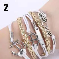 Handmade leather braided bracelet with variety of charms